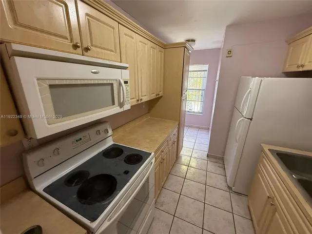 a kitchen with a stove and a microwave