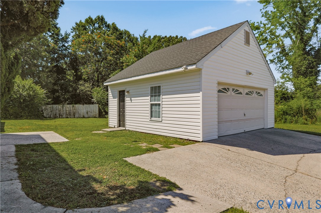 5101 Kenmare Loop Richmond, VA 23234 - Photo 40 of 43 2 car garage with automatic door and storage above