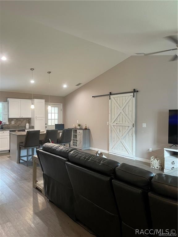 13591 Southwest 112th Street Dunnellon, FL 34432 - Photo 8 of 24 a living room with furniture and a flat screen tv