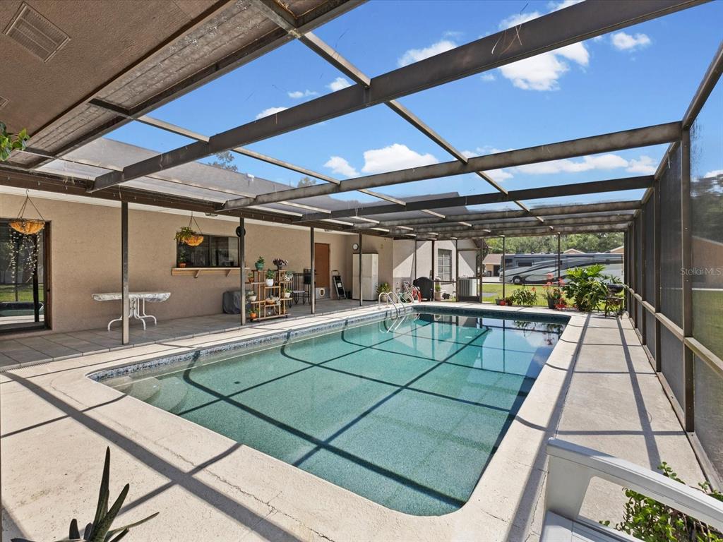 10700 Luscombe Court New Port Richey, FL 34654 - Photo 3 of 64 a view of a indoor swimming pool