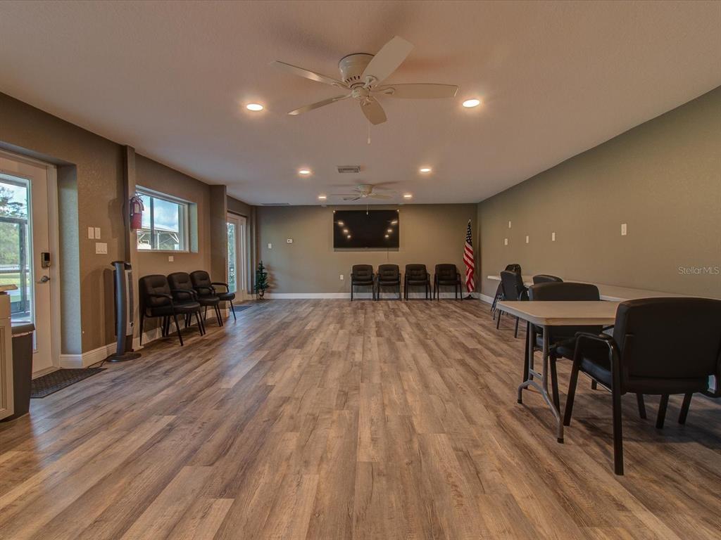 10700 Luscombe Court New Port Richey, FL 34654 - Photo 60 of 64 a living room with furniture and a wooden floor