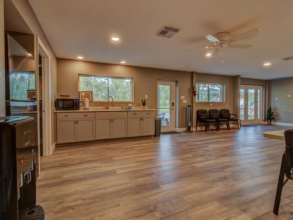 10700 Luscombe Court New Port Richey, FL 34654 - Photo 61 of 64 a view of kitchen with furniture and wooden floor