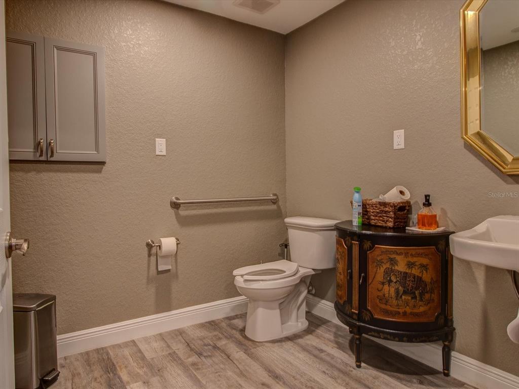 10700 Luscombe Court New Port Richey, FL 34654 - Photo 62 of 64 a bathroom with a toilet and a sink