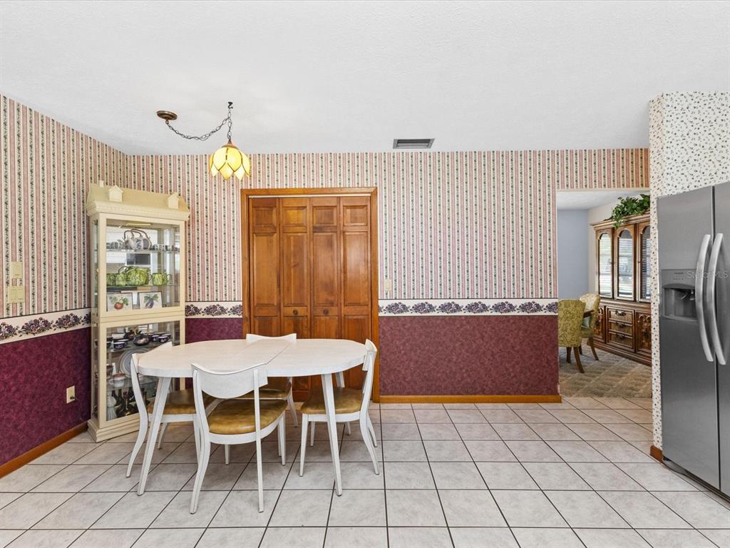 10700 Luscombe Court New Port Richey, FL 34654 - Photo 8 of 64 a view of a dining room with furniture