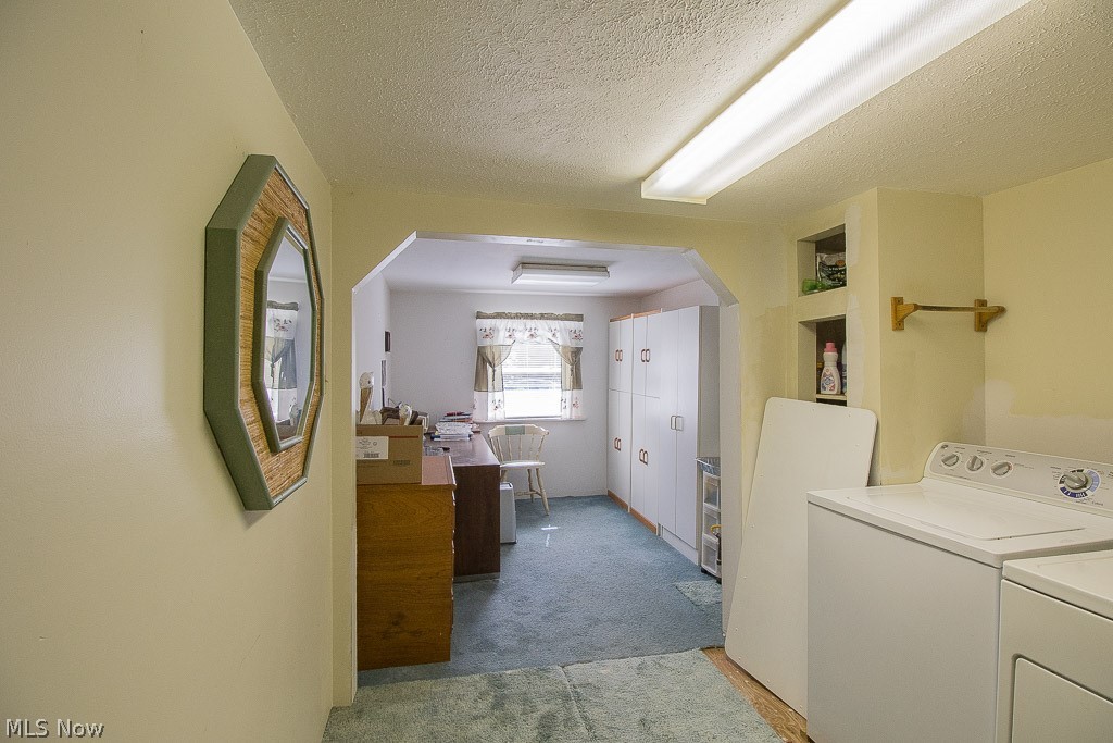 4181 Maple Street Perry, OH 44081 - Photo 14 of 20 Seperate hallway leads to original first floor bedroom suite and is presently used as an office with built in storage and 8x7 laundry room area.