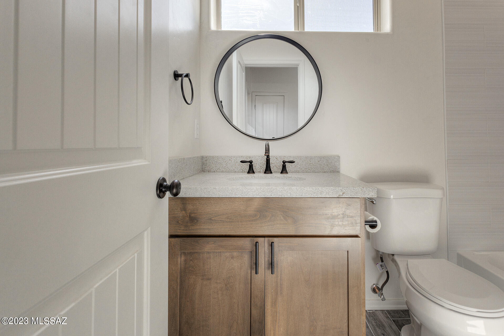 1813 Cajeme Court Rio Rico, AZ 85648 - Photo 13 of 15 a bathroom with a sink toilet and a mirror