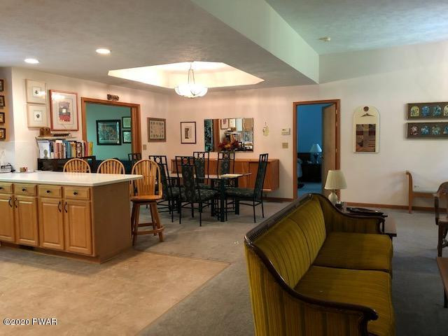 116 Maple Ridge Drive Hawley, PA 18428 - Photo 17 of 19 a living room with furniture kitchen view and a large window