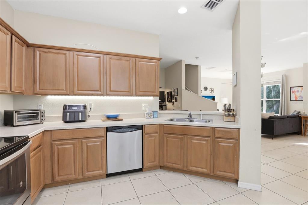 6458 South Goldenrod Road, Unit 29B Orlando, FL 32822 - Photo 15 of 40 a kitchen with a sink and cabinets