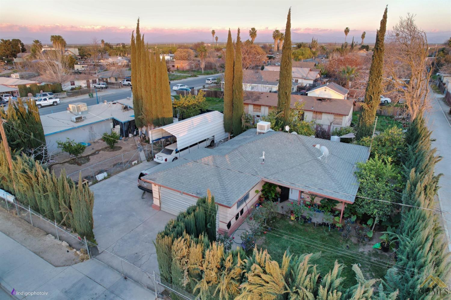 Undisclosed Address Richgrove, CA 93261 - Photo 17 of 21 an aerial view of multiple houses with a yard