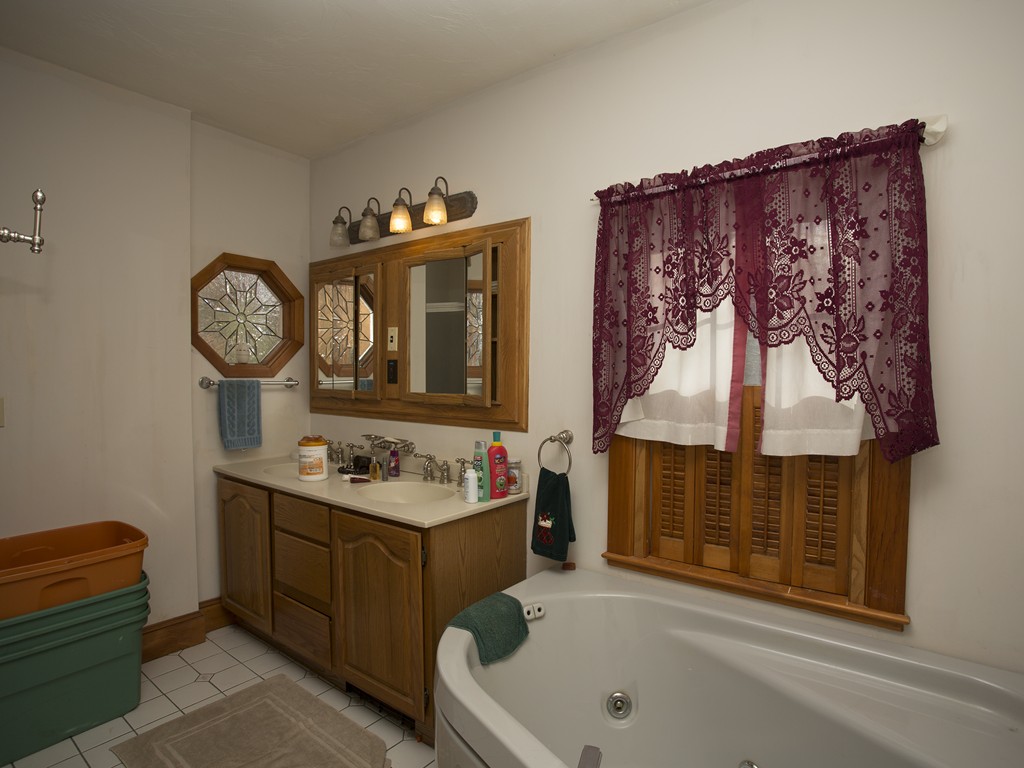 71 Tifft Road North Smithfield, RI 02896 - Photo 14 of 30 a bathroom with a toilet sink and mirror
