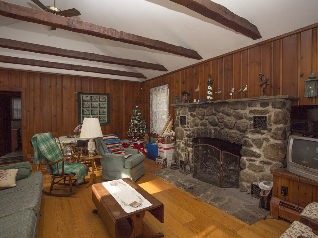 71 Tifft Road North Smithfield, RI 02896 - Photo 15 of 30 a living room with furniture a fireplace and a dining table