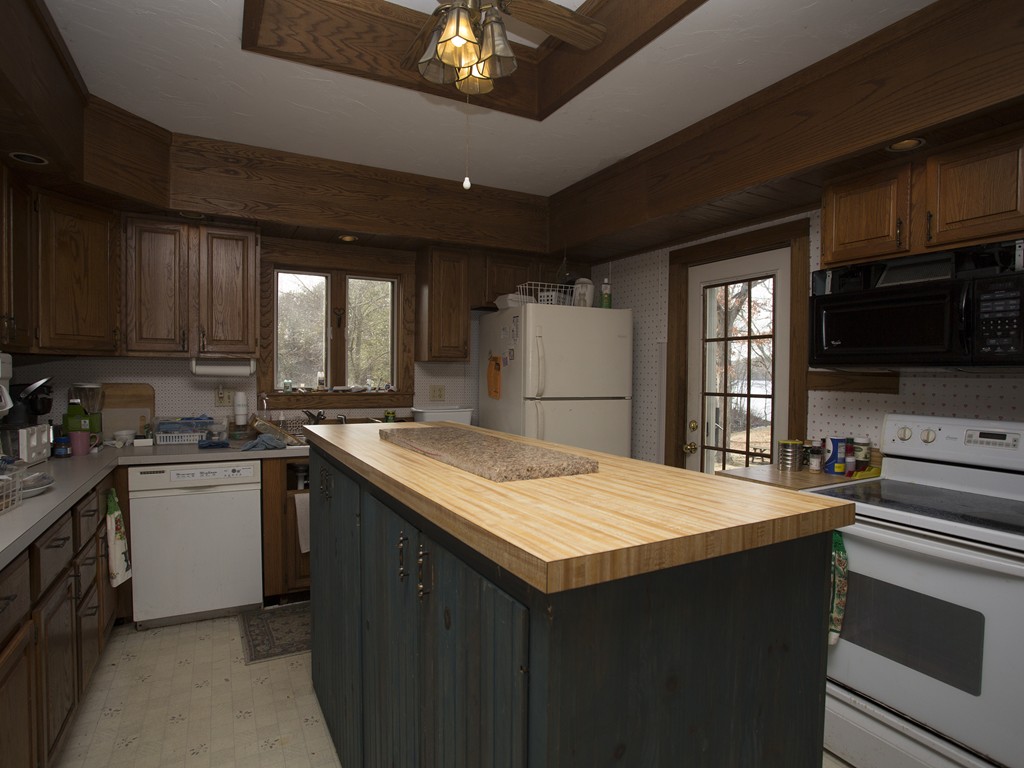 71 Tifft Road North Smithfield, RI 02896 - Photo 19 of 30 a kitchen with stainless steel appliances granite countertop a sink stove and refrigerator