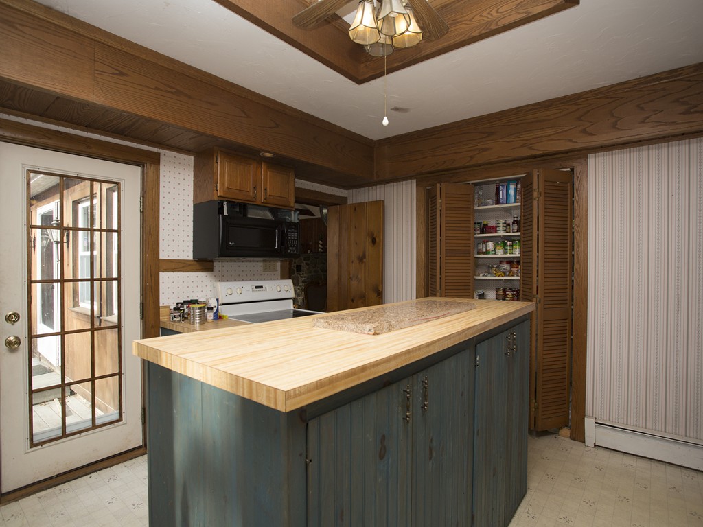 71 Tifft Road North Smithfield, RI 02896 - Photo 20 of 30 a kitchen with a stove a refrigerator and a microwave oven