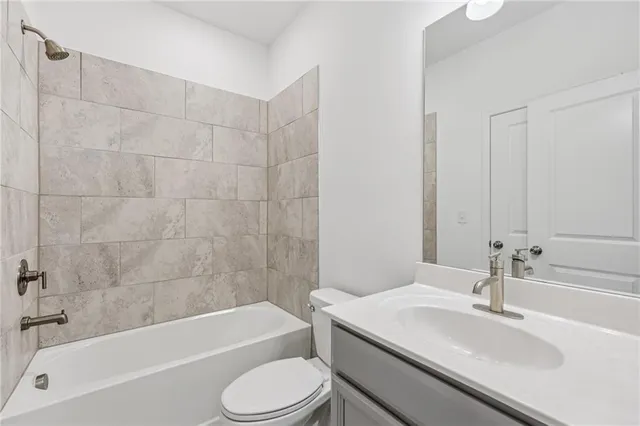 a bathroom with a sink toilet and bathtub