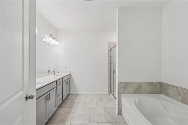 a bathroom with a bathtub and shower