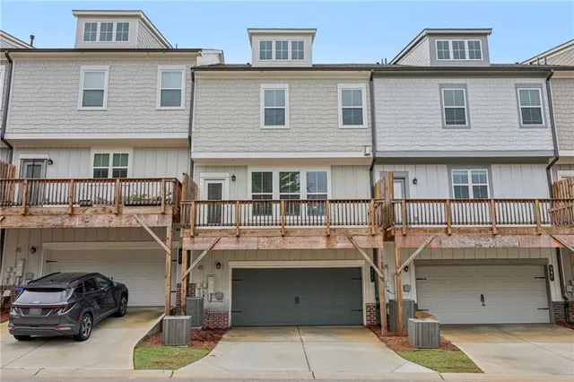 a picture of a bathroom with a refrigerator