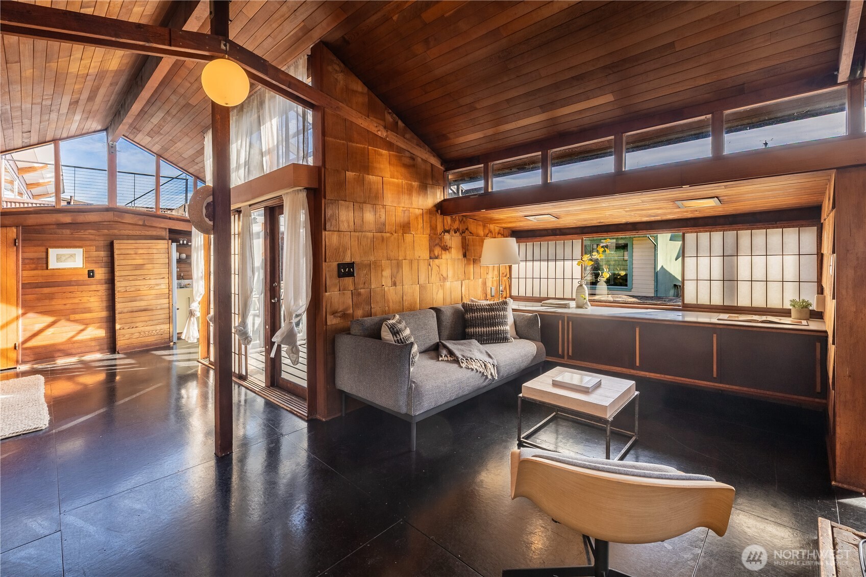 3130 Portage Bay Place East, Unit C Seattle, WA 98102 - Photo 2 of 40 a living room with furniture and a large window