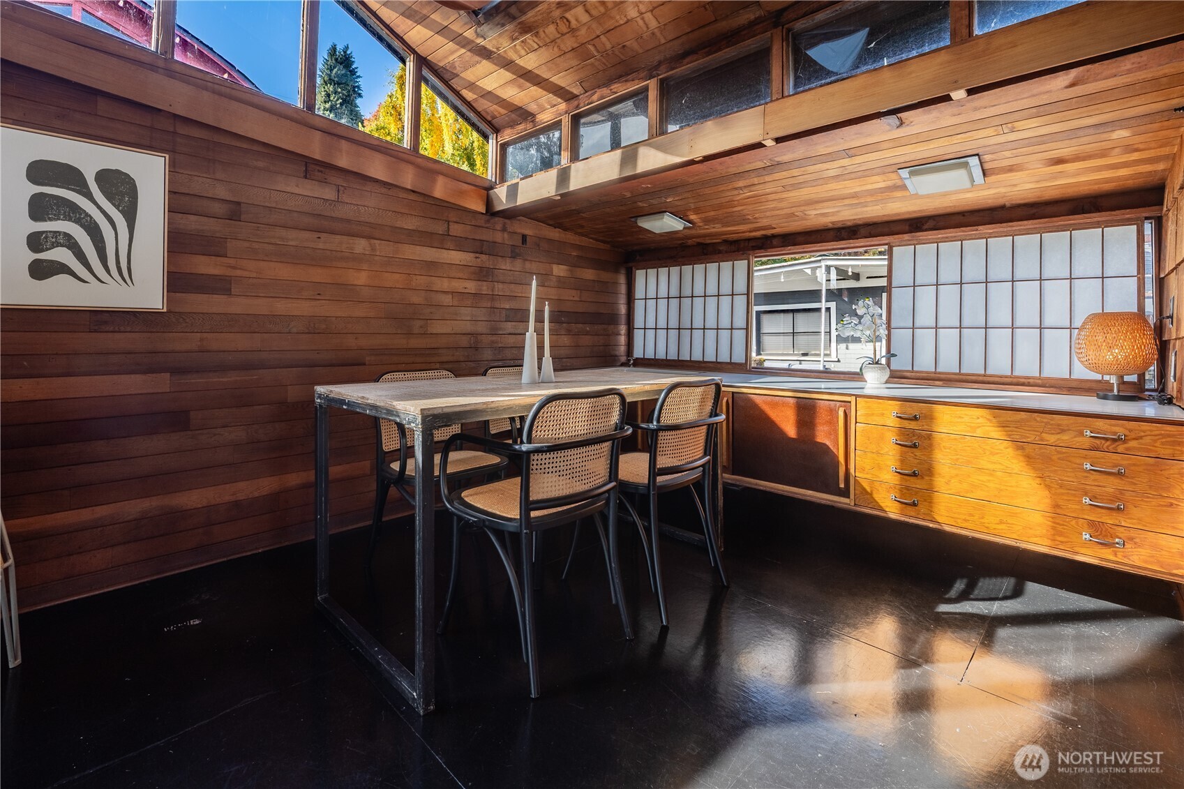 3130 Portage Bay Place East, Unit C Seattle, WA 98102 - Photo 27 of 40 a view of a patio with table and chairs with wooden floor