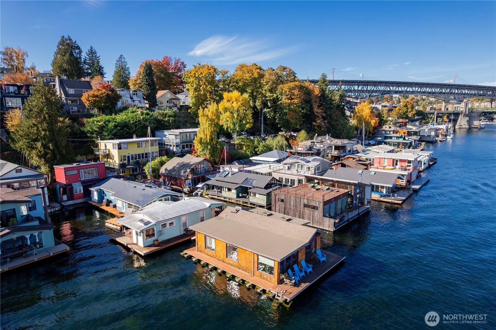 3130 Portage Bay Place East, Unit C Seattle, WA 98102 - Photo 39 of 40 a group of blue and white sitting sitting on a swimming pool with a lawn chairs