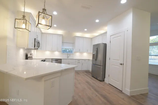 a view of a kitchen and a sink