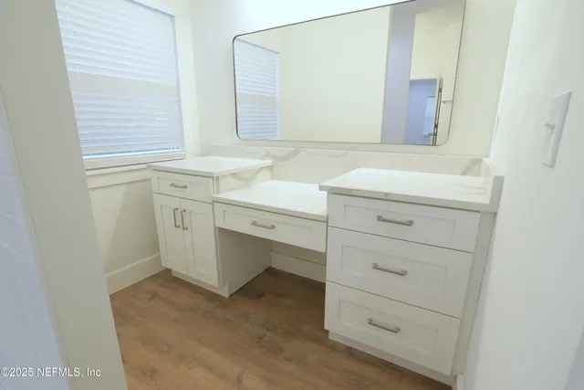 a view of cabinets and wooden floor