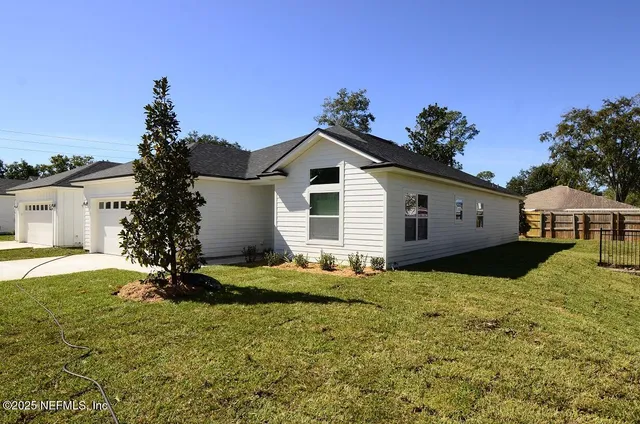 a front view of a house with a yard
