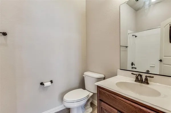 an empty room with closet and windows