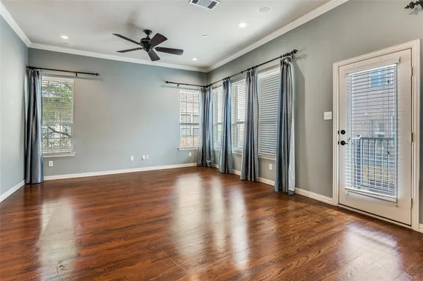 a large kitchen with granite countertop a large counter top and stainless steel appliances