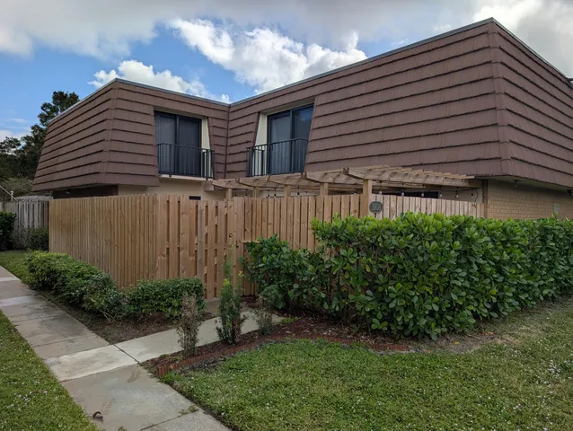 a house view with a backyard space
