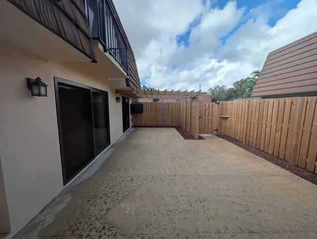 a view of a yard with cars