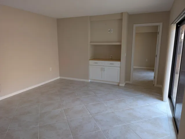 a view of an empty room and closet