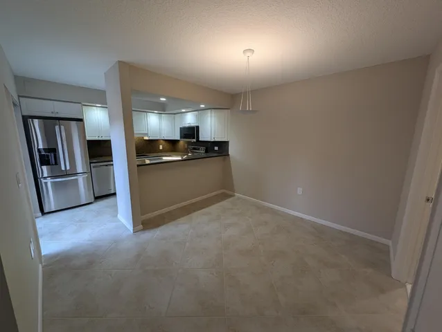 a view of a kitchen with a sink