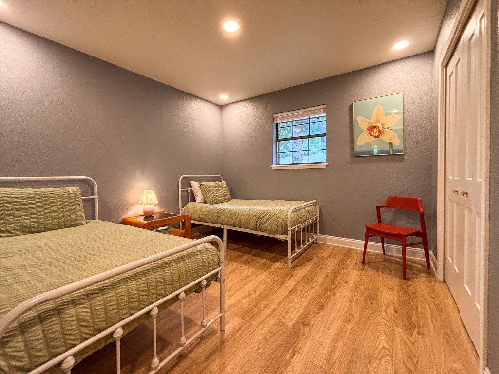 406 Concho Street, Unit B Lockhart, TX 78644 - Photo 13 of 21 a bedroom with two beds and a desk