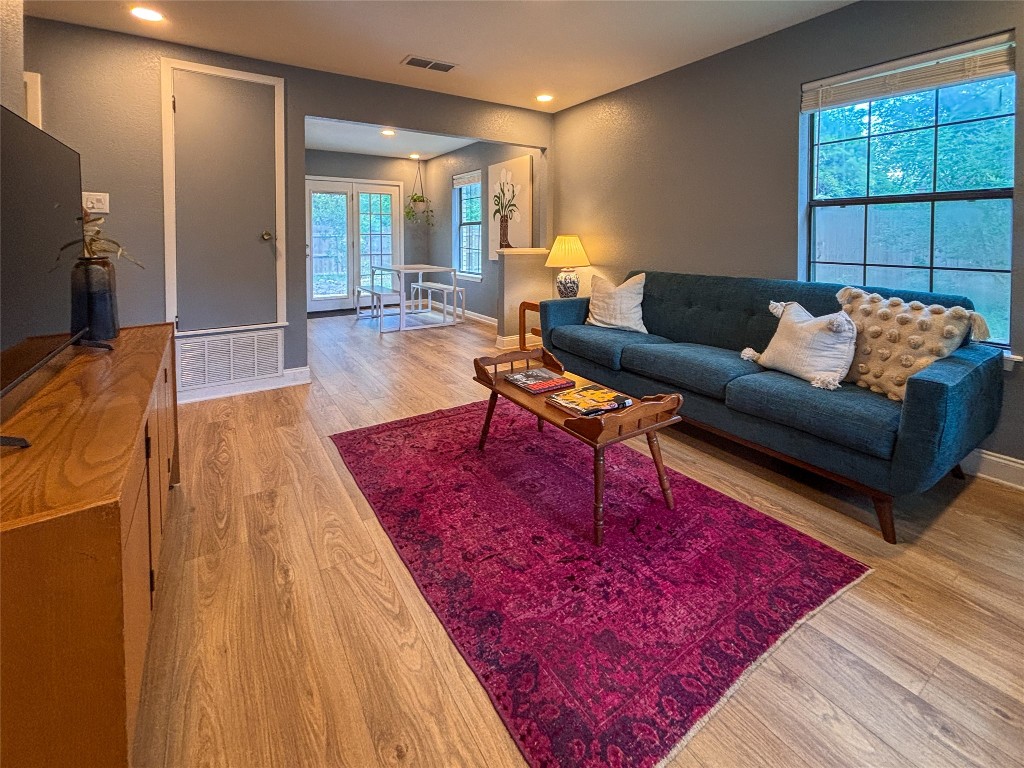 406 Concho Street, Unit B Lockhart, TX 78644 - Photo 5 of 21 a living room with furniture and a rug