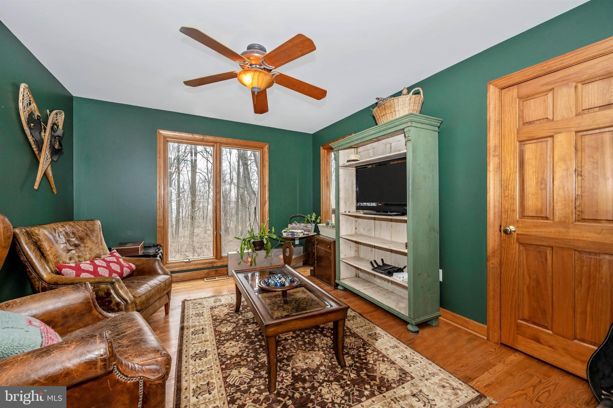5130 Shookstown Road Frederick, MD 21702 - Photo 22 of 87 a living room with furniture a flat screen tv and a window