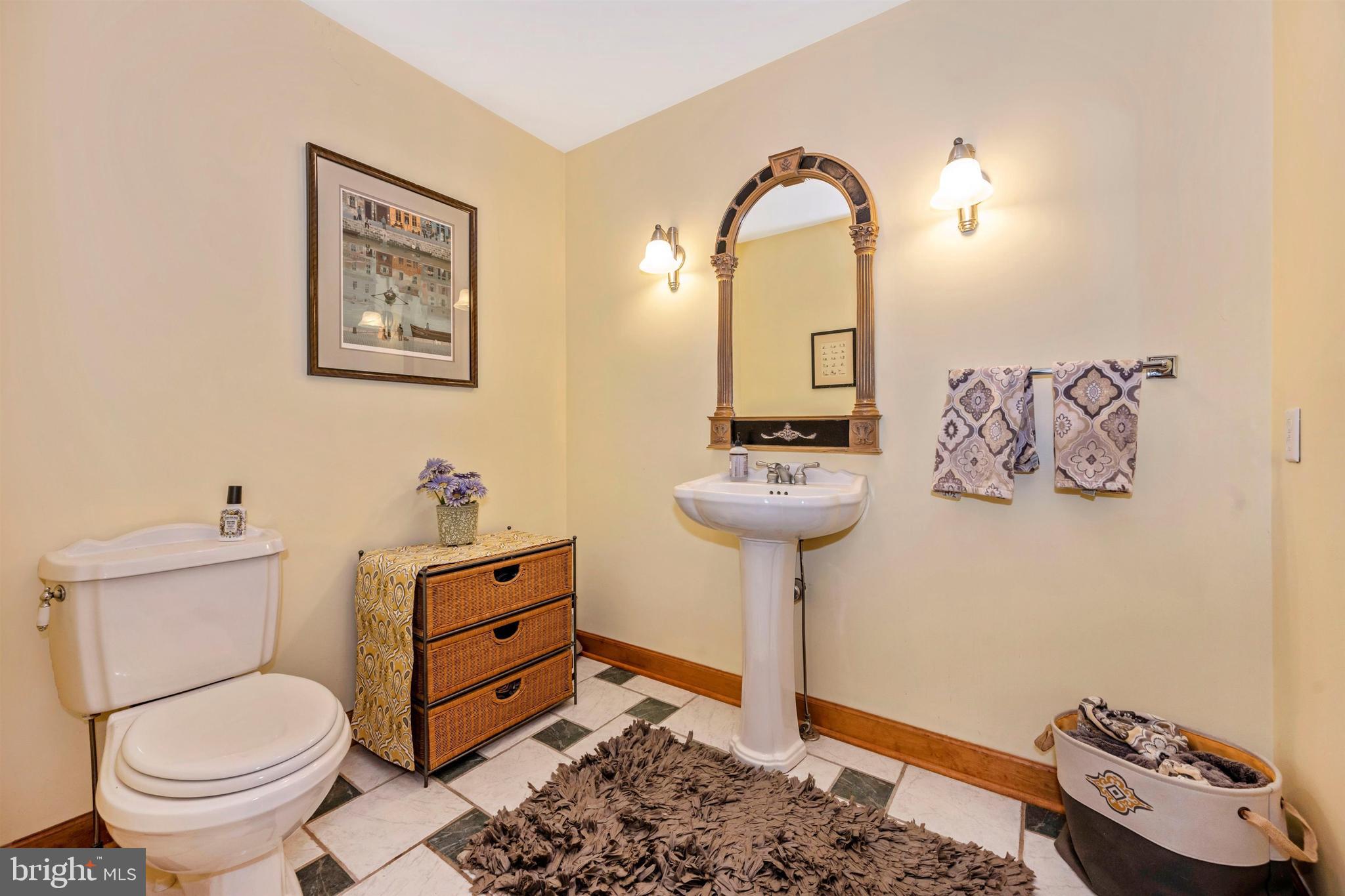 5130 Shookstown Road Frederick, MD 21702 - Photo 25 of 87 a bathroom with a toilet sink and mirror