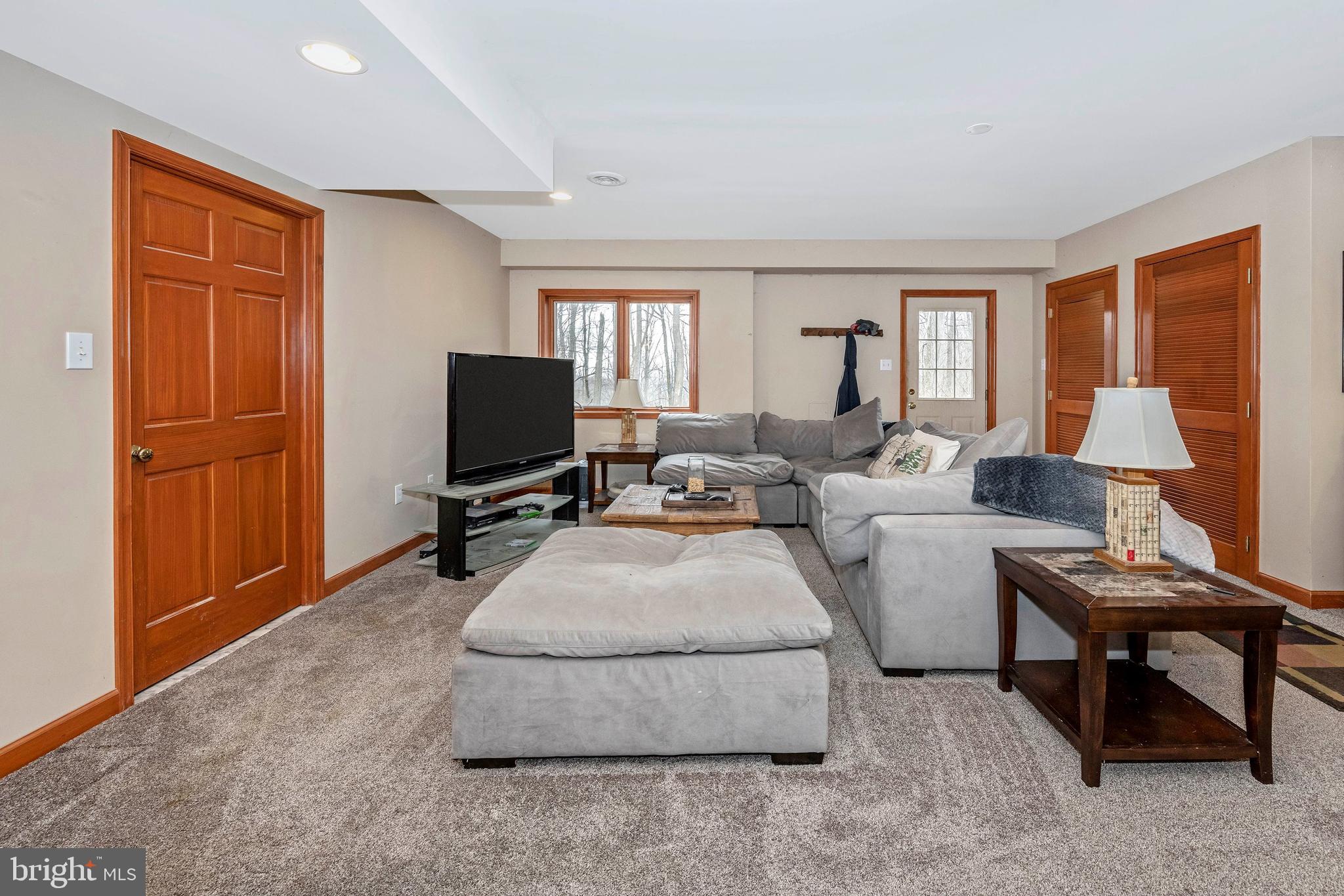 5130 Shookstown Road Frederick, MD 21702 - Photo 33 of 87 a living room with furniture and a flat screen tv