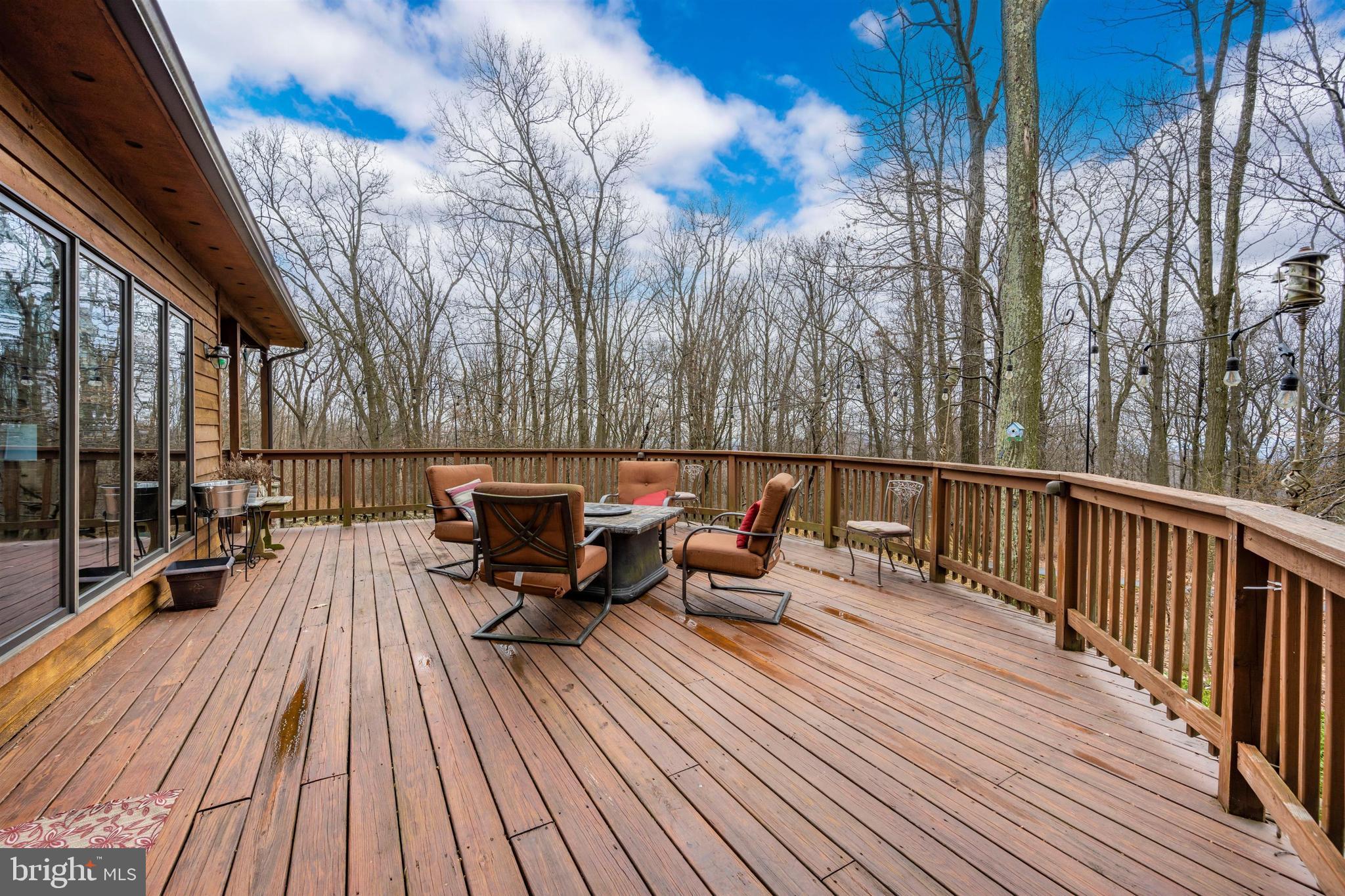 5130 Shookstown Road Frederick, MD 21702 - Photo 45 of 87 a balcony with wooden floor and outdoor seating