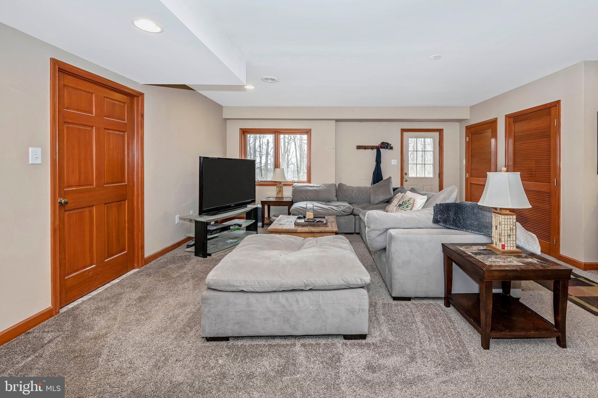 5130 Shookstown Road Frederick, MD 21702 - Photo 7 of 87 a living room with furniture and a flat screen tv