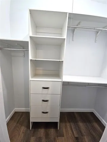 a view of an empty walk in closet
