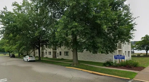 a view of a house with a street