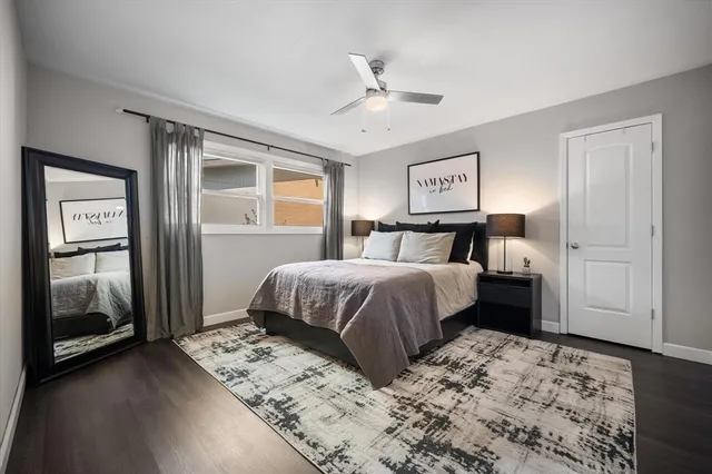 a bedroom with a large bed and a window