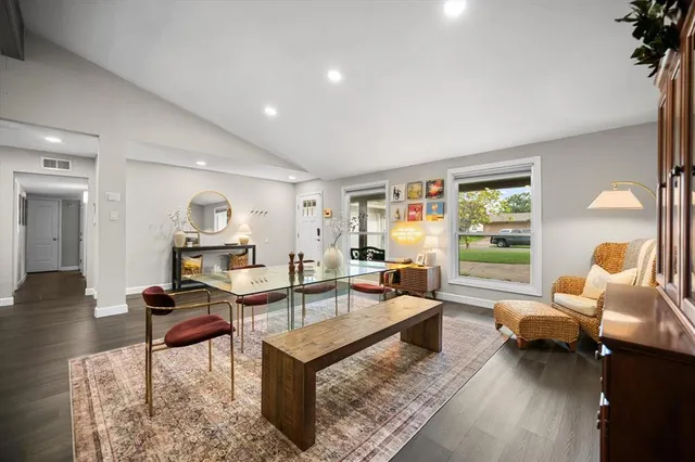 a living room with furniture and a table