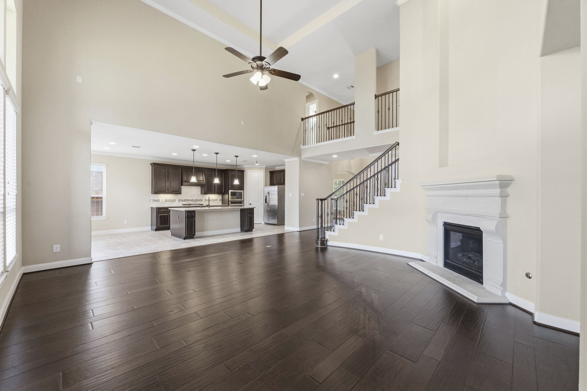 25210 Gaddis Oaks Drive Spring, TX 77389 - Photo 49 of 50 a view of an empty room with wooden floor fireplace and a window
