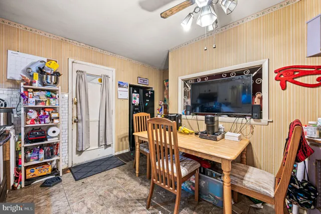 a view of a livingroom with furniture and a flat screen tv