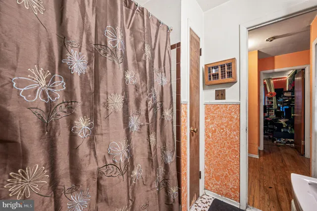 a view of entryway with wooden floor and stairs