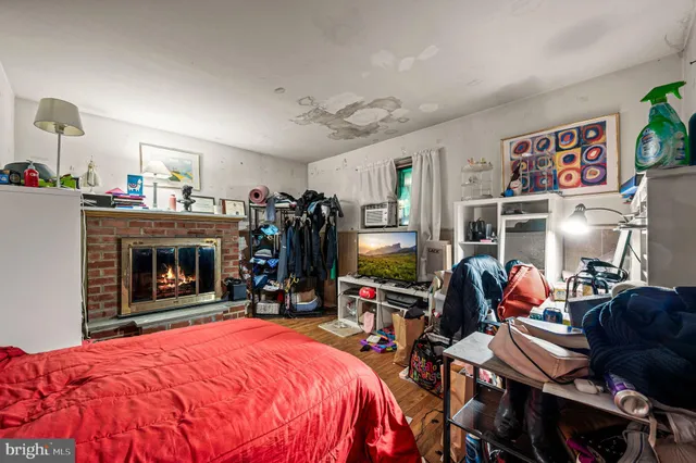 a bed room with a bed and a fireplace