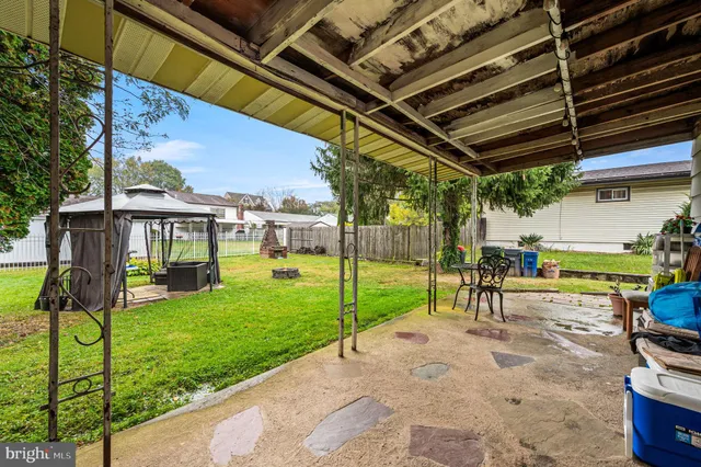a view of yard with patio