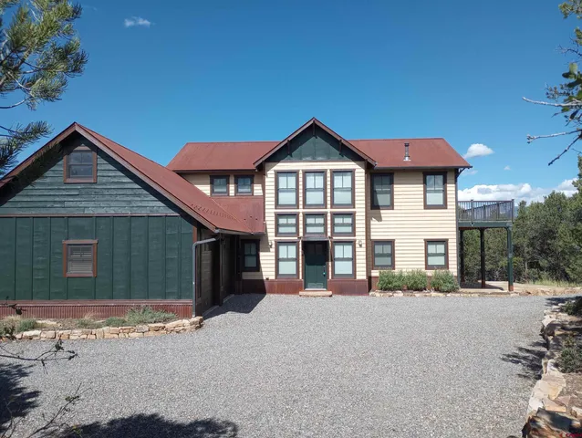 a bathroom with a sink toilet a mirror and window
