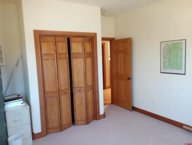 a bedroom with bed and window